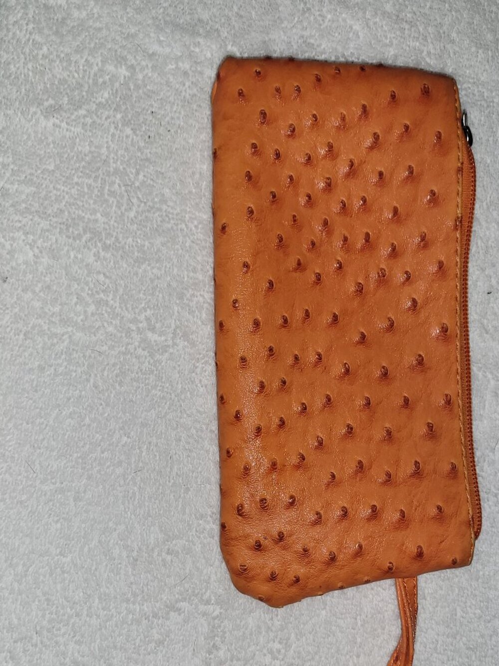 Faux ostrich leather clutch in orange